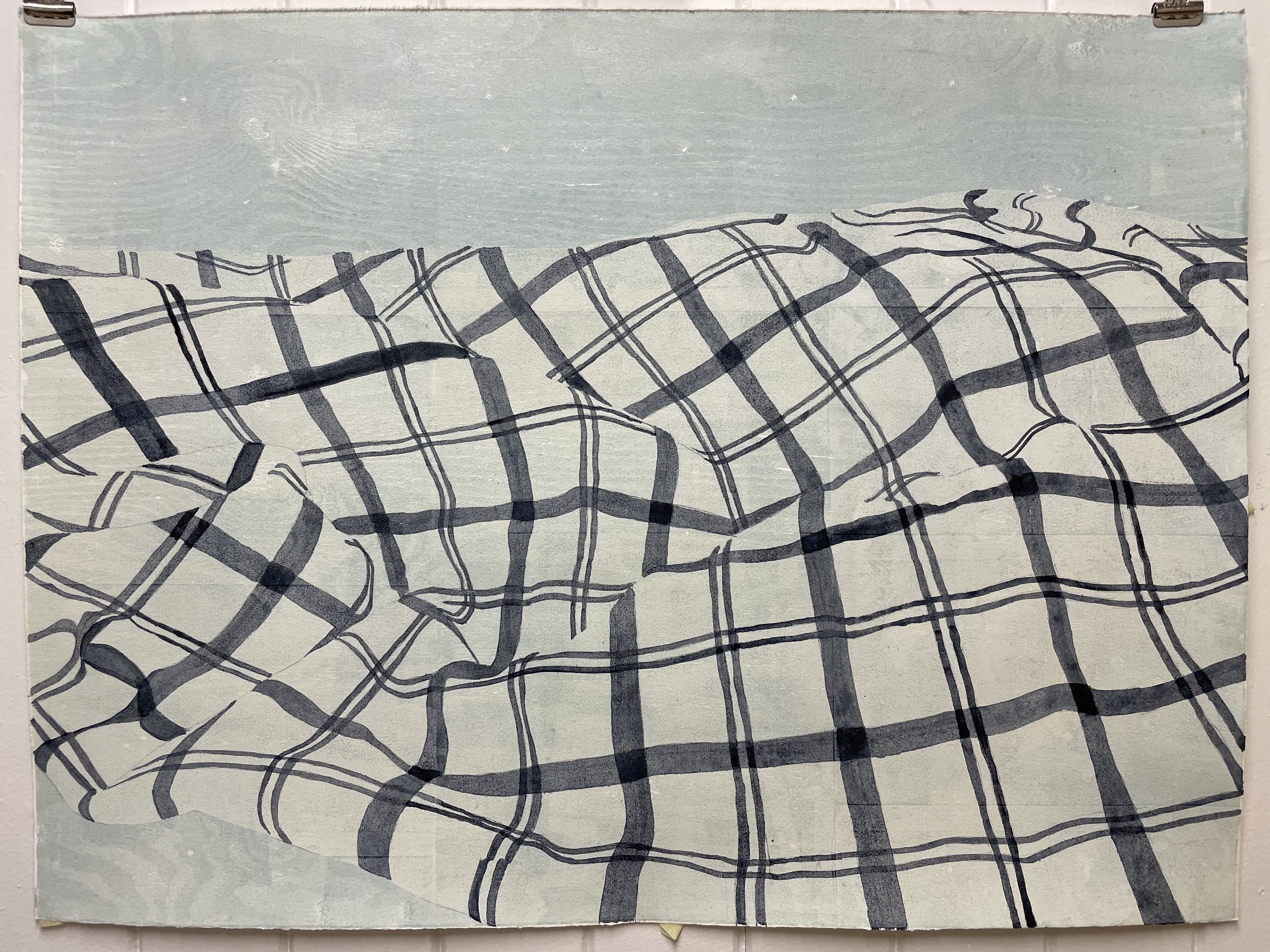 Tresnitt og monotypi. En rutete duk som er krøllet